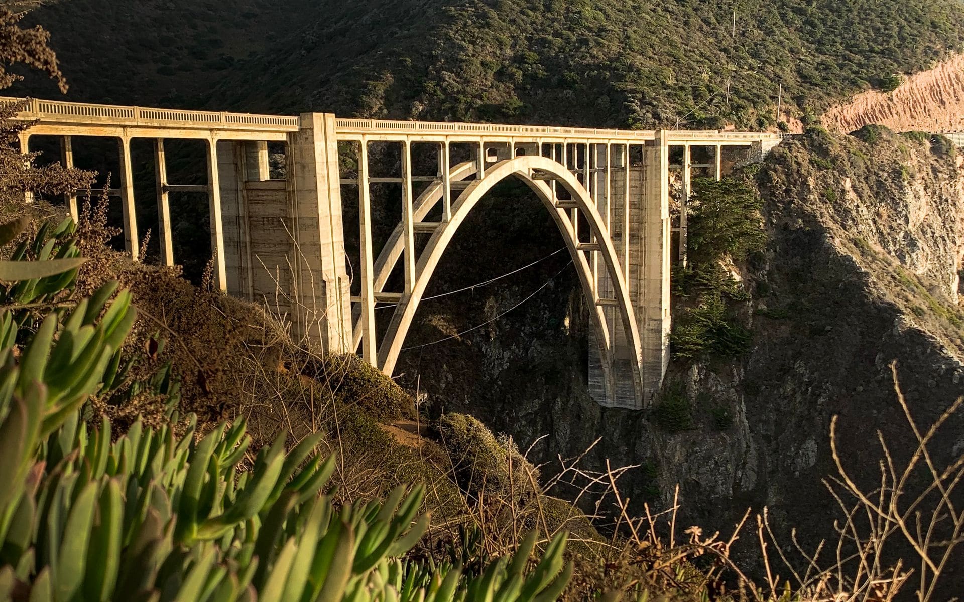 Bixby Creek Bridge arcing across a canyon on Highway 1 in Big Sur with the Pacific below