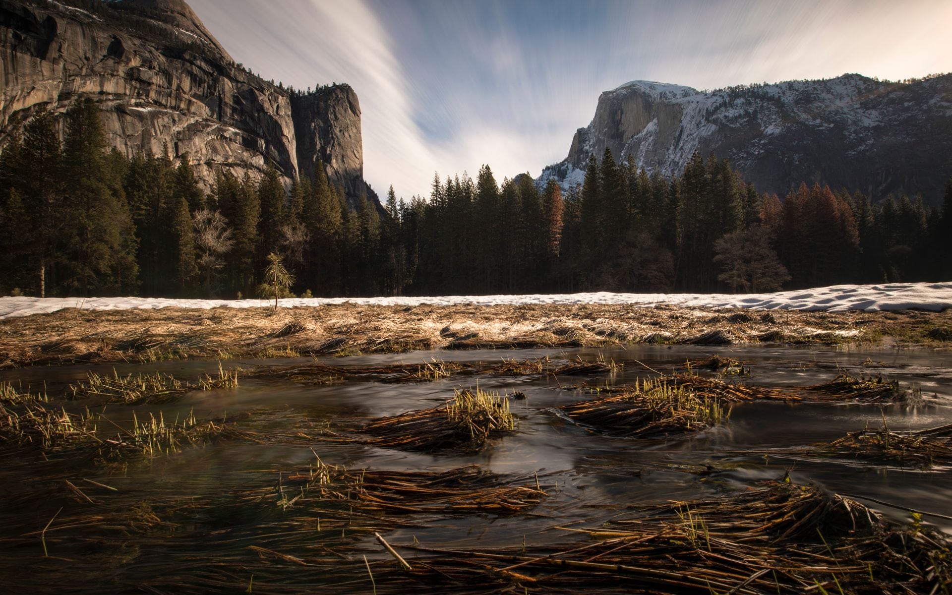 Yosemite Valley meadow with the Merced River in the foreground and Half Dome rising in the distance